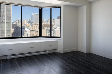 Living room - mid-sized modern enclosed porcelain tile and black floor living room idea in San Francisco with white walls