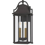 Quoizel - Manning 2-Light Outdoor Wall Mount in Western Bronze - Bring a welcoming glow to your home's entrance with the Manning collection. This traditional style lantern is finished in Western Bronze and gives off an old gaslight feel. The clear glass panels allow for an unobstructed view of the light's interior which features  Weathered Brass candsleeves for a unique, dual-tone look.  This light requires 2 , 60 Watt Bulbs (Not Included) UL Certified.
