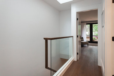 Inspiration for a contemporary dark wood floor and brown floor hallway remodel in Vancouver