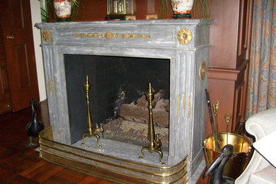 Inspiration for a mid-sized timeless formal and enclosed dark wood floor living room remodel in Houston with a standard fireplace, a stone fireplace and no tv