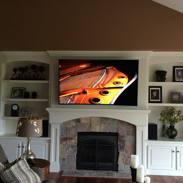 Curved Television Mount Above Fireplace