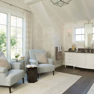 Example of a large coastal master dark wood floor and brown floor bathroom design in San Francisco with furniture-like cabinets, white cabinets, an undermount sink, gray countertops and white walls