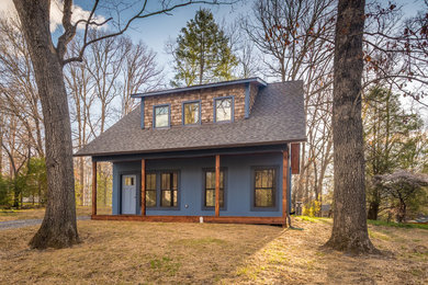 Example of a cottage chic exterior home design in Other
