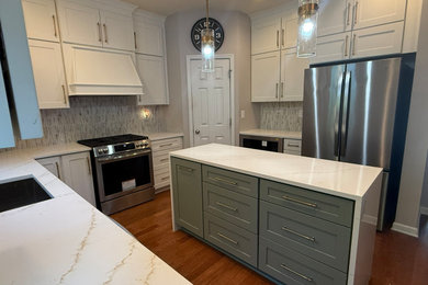 Inspiration for a mid-sized transitional u-shaped eat-in kitchen remodel in Atlanta with shaker cabinets, white cabinets, quartz countertops and an island