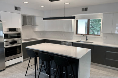 Inspiration for a mid-sized contemporary l-shaped porcelain tile and multicolored floor eat-in kitchen remodel in Other with an undermount sink, flat-panel cabinets, white cabinets, quartz countertops, multicolored backsplash, quartz backsplash, stainless steel appliances, an island and multicolored countertops
