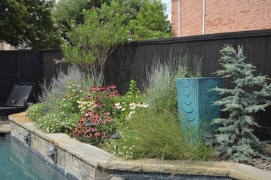 This is an example of a small traditional drought-tolerant and full sun backyard landscaping in Dallas.