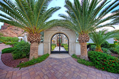 Example of a huge tuscan white one-story stucco exterior home design in Phoenix