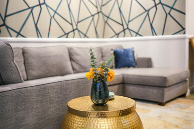 Living room - contemporary open concept gray floor living room idea in Los Angeles with multicolored walls