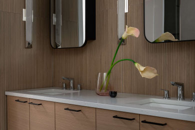 Example of a small trendy master beige tile and porcelain tile porcelain tile, gray floor and double-sink bathroom design in Toronto with flat-panel cabinets, light wood cabinets, a bidet, white walls, an undermount sink, quartz countertops, a hinged shower door, white countertops, a niche and a floating vanity