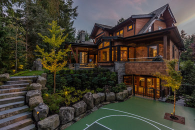 Example of a mountain style three-story wood gable roof design in Vancouver