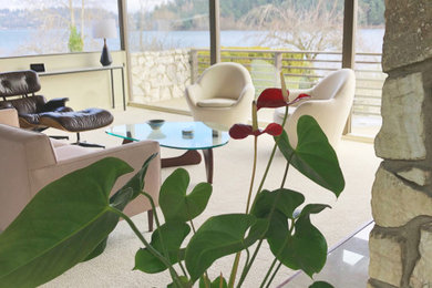 Inspiration for a mid-century modern carpeted and white floor living room remodel in Seattle with a standard fireplace and a stone fireplace