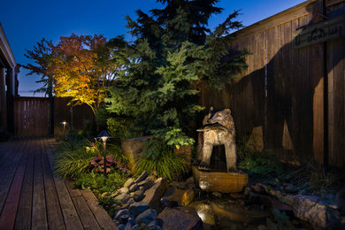 Design ideas for a mid-sized arts and crafts backyard garden in Seattle.
