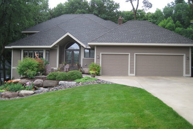 Example of a mid-sized classic gray one-story wood exterior home design in Minneapolis
