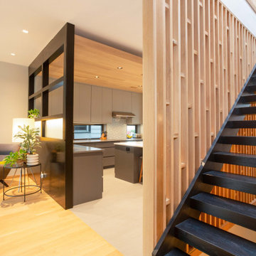 Architectural Floating Staircase with Slatted Oak Wall Feature