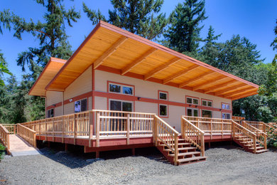Inspiration for a mid-sized contemporary one-story house exterior remodel in Other