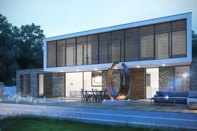 Cette image montre une façade de maison blanche design en pierre de taille moyenne et à un étage avec un toit plat et un toit en shingle.