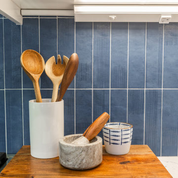 Blue Tile Backsplash Detail with Warm Wood Accents