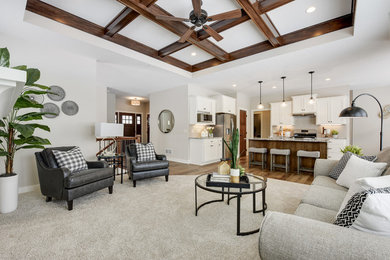Living room - large transitional open concept dark wood floor and brown floor living room idea in Minneapolis with beige walls, a standard fireplace, a stone fireplace and a wall-mounted tv