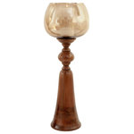 Harp and Finial - Puri Candle Holder Medium Smoked Glass & Natural Wood Finish - Designed to hold a single candle, the midsize Puri Candle Holder is a stunning transitional accent piece composed of a smoke glass globe atop a wood base with a natural brown finish. This medium-sized wood and glass candle holder features a unique, curving shape and combines the natural look of teak root with the elegance of smoked glass. Bring light to a dining room, living room, bedroom, or foyer with this exquisite candle holder.