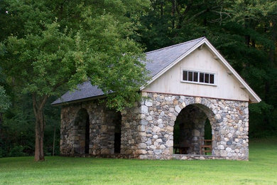 Example of a mid-sized mountain style backyard patio design in New York with a gazebo