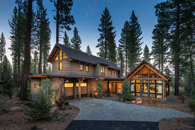 Example of a mountain style two-story wood gable roof design in Sacramento
