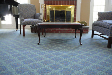 Large elegant formal and enclosed carpeted living room photo in Portland Maine with beige walls, a standard fireplace and a brick fireplace