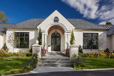 Transitional beige one-story stone house exterior photo in Denver