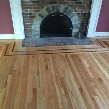 Newly installed 2 1/4" Red Oak hardwood floor with inlay