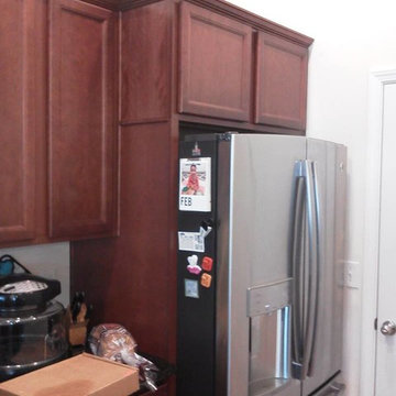Upper cabinet above refrigerator bumped out