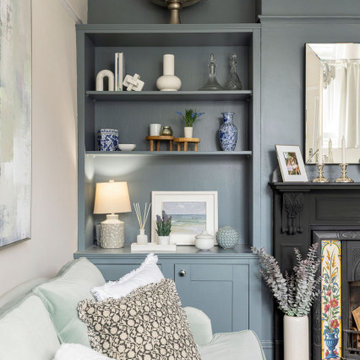 Calm & serene living room with a mix of chrome & brass metal accents