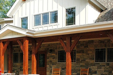 Example of a mid-sized arts and crafts white two-story wood gable roof design in Nashville