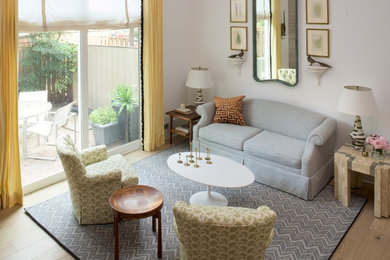 Eclectic open concept light wood floor living room photo in DC Metro with white walls, a corner fireplace and a stone fireplace