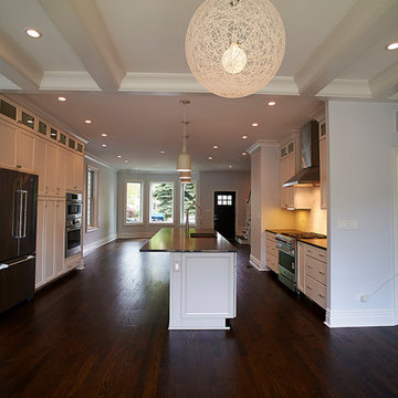 Modern Open-Concept Kitchen with Island, Hardwood Floors, and Sleek Finishes