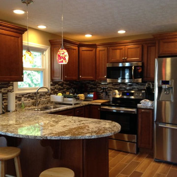Kitchen (After) Ceramic tile that looks like wood.