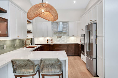 Large u-shaped eat-in kitchen photo in Miami with an undermount sink, shaker cabinets, white cabinets, quartz countertops, stainless steel appliances, a peninsula and white countertops