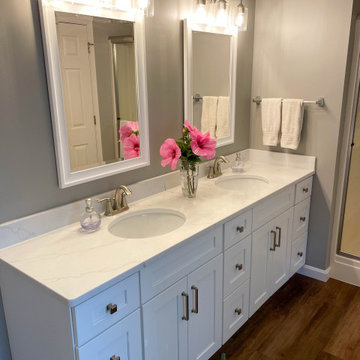Bathroom Update with White Vanity, Calacatta Miraggio countertop, LVT flooring