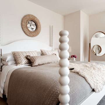 Calm principal bedroom with upholstered headboard