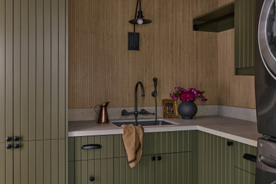 Design ideas for an arts and crafts laundry room in Toronto with beaded inset cabinets and green cabinets.