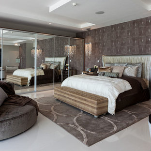 Photo of an expansive contemporary master bedroom in Miami with brown walls, no fireplace and marble floors.