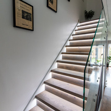 Closed Riser stairs with frameless glass balustrade to stairs and landing