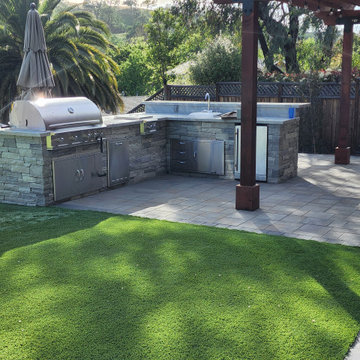 Outdoor kitchen, firepit, pergola, and Synthetic turf