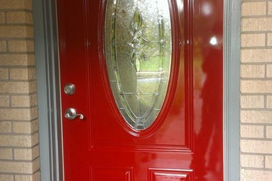Brick floor single front door photo in Austin with beige walls and a red front door