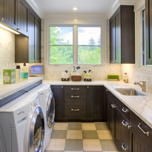 Inspiration for a victorian u-shaped separated utility room in San Francisco with dark wood cabinets, a side by side washer and dryer and multi-coloured floors.