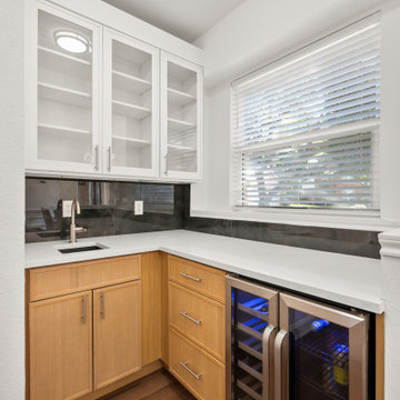 Compact Wet Bar Nook with Oak Base Cabinets and Wine Fridge