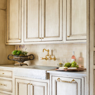 Traditional kitchen pantry photos - Inspiration for a timeless medium tone wood floor and brown floor kitchen pantry remodel in Little Rock with raised-panel cabinets, beige cabinets, marble countertops, beige backsplash and white countertops