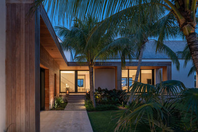 Inspiration for a large coastal white two-story mixed siding exterior home remodel with a shingle roof