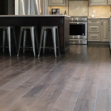 Farmhouse kitchen Taupe Painted Cabinets,Quartz Tops, and Dark Island