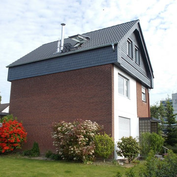 Aufstockung Raschke - Aufstockung eines Reihenendhauses in Holzbauweise