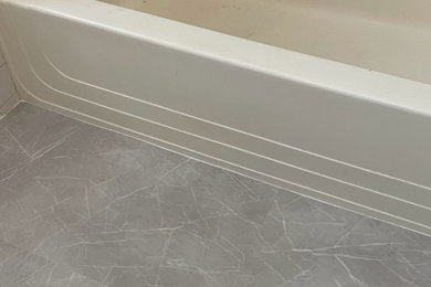Elegant porcelain tile and gray floor bathroom photo in Boston