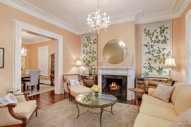 Inspiration for a large traditional formal enclosed living room in Chicago with beige walls, medium hardwood floors, a standard fireplace, a stone fireplace surround and no tv.